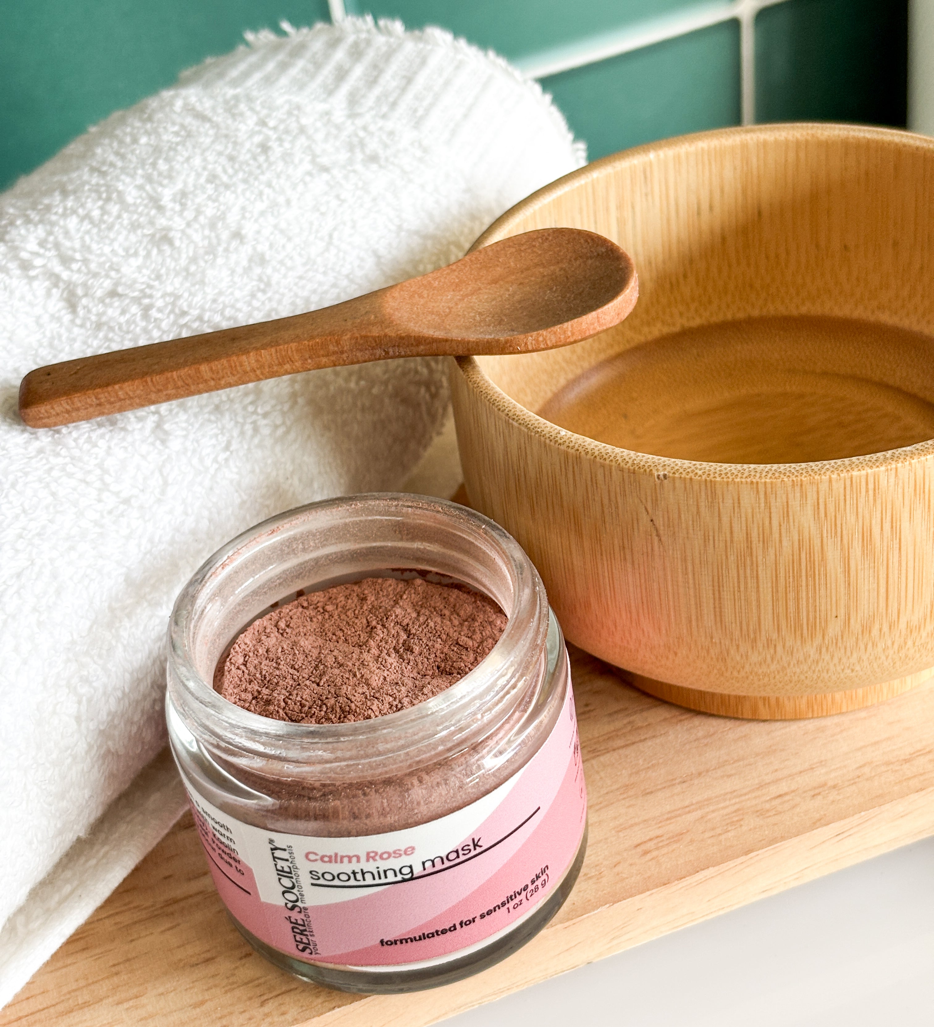 Calm Rose Soothing Mask with a bamboo spoon and bowl with towel for a facial mask