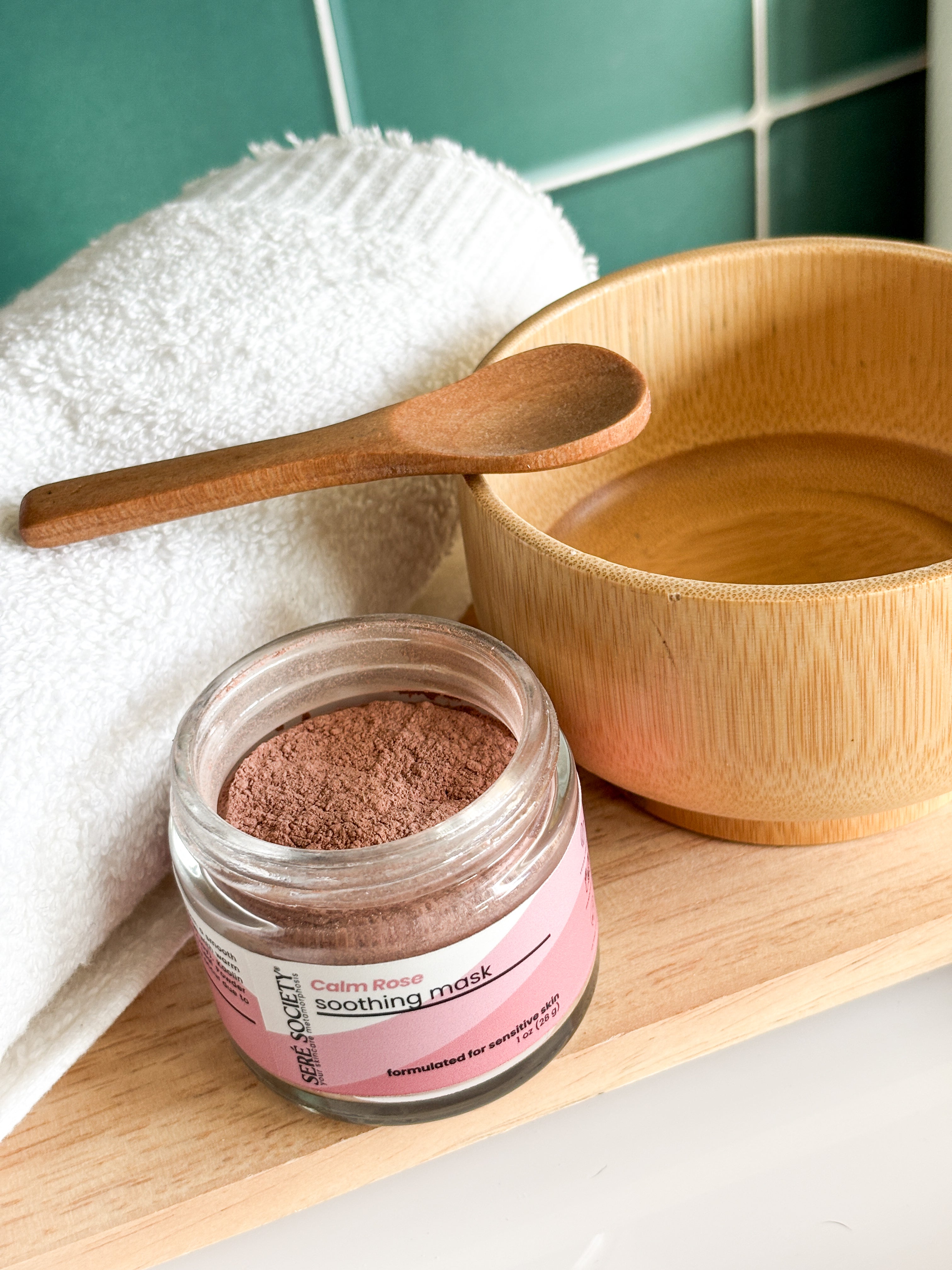 Calm Rose Soothing Mask with a bamboo spoon and bowl with towel for a facial mask