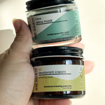 hand holding the Clara detox mask and sol deodorant cream bundle